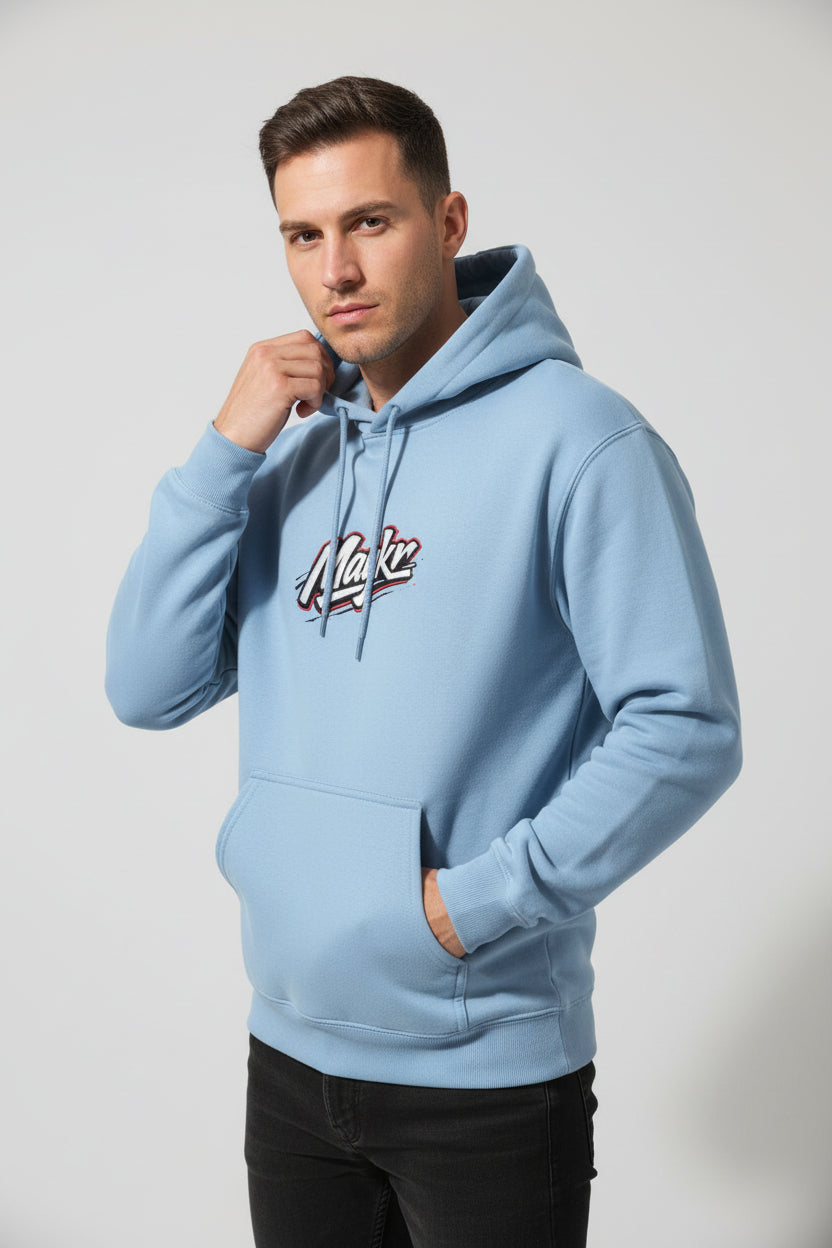 Light blue MAYKR Classic Trend Hoodie on a male model; 100% cotton, 300 GSM brushed fleece, front pocket.